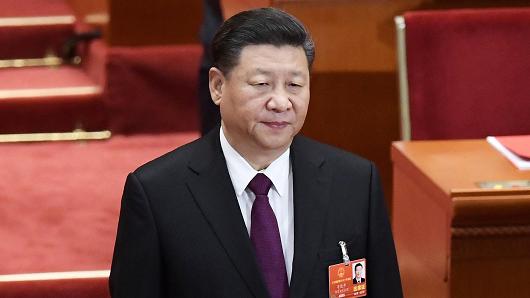 Chinese President Xi Jinping arrives for the closing session of the National People's Congress (NPC) at the Great Hall of the People in Beijing on March 20, 2018.
