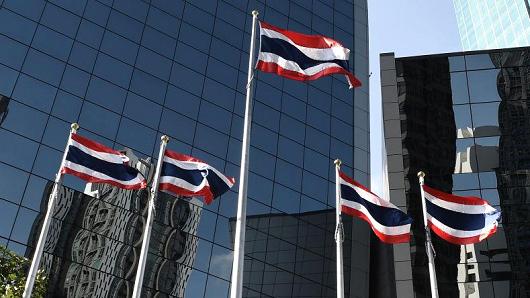 Thai flags are seen outside of the Stock Exchange of Thailand in Bangkok on January 8, 2018.