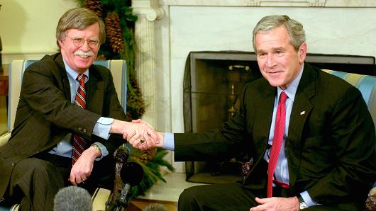President George W. Bush (R) and Ambassador to the UN John Bolton (L) meet in the Oval Office of the White House December 4, 2006 in Washington, DC. Bush accepted Bolton's resignation as Ambassador to the United Nations when his term is up in January 2007.