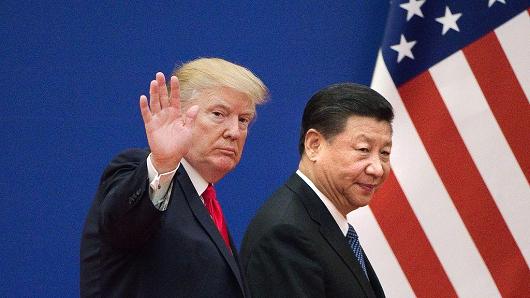 US President Donald Trump and China's President Xi Jinping leave a business leaders event at the Great Hall of the People in Beijing on November 9, 2017.