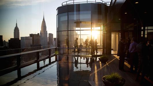 Guests attend a pool party in the penthouse apartment at the 50 United Nations Plaza building in New York. About 3,574 newly built apartments will reach the market in 2016, according to brokerage Corcoran Sunshine Marketing Group.