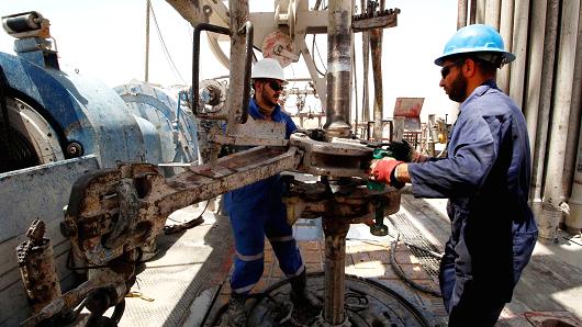 Men work for Iraqi Drilling Company at Rumaila oilfield in Basra, Iraq,