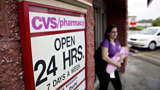A customer exits a CVS Health Corp. pharmacy in La Vista, Nebraska.