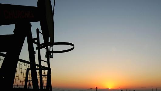 Oil rigs at sunrise in Taft, California.