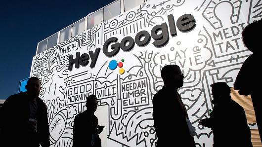 The silhouettes of attendees are seen at the Google booth during the 2018 Consumer Electronics Show (CES) in Las Vegas, Jan. 11, 2018.