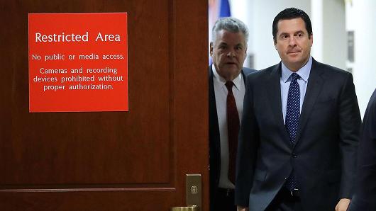 House Intelligence Committee Chairman Devin Nunes (R-CA) (2nd L) and Rep. Peter King (R-NY) leave the committee's secure meeting rooms in the basement of the U.S. Capitol House Visitors Center February 6, 2018 in Washington, DC.