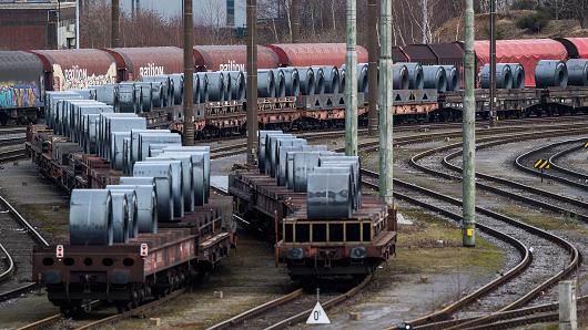Coils of steel stand on trains in front of the ThyssenKrupp steel mill on March 5, 2018 in Duisburg, Germany.