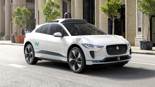 Jaguar's I-Pace SUV, modified with self-driving technology, will be used in Waymo's ride-hailing fleet.