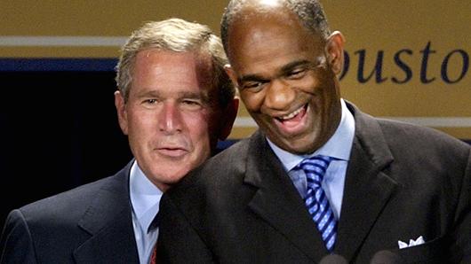 President George W. Bush, left, shares a laugh with Pastor Kirbyjon Caldwell as they are introduced during a fundraiser for the Power Center, a huge multi-use complex in southwest Houston, which is celebrating its' 10th anniversary Friday, Sept. 12, 2003.