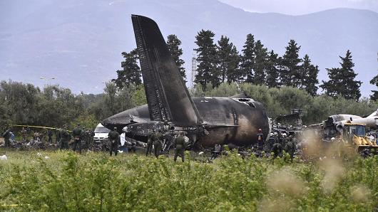 Rescuers are seen around the wreckage of an Algerian army plane which crashed near the Boufarik airbase from where the plane had taken off on April 11, 2018. The Algerian military plane crashed and caught fire killing 257 people, mostly army personnel and members of their families, officials said.