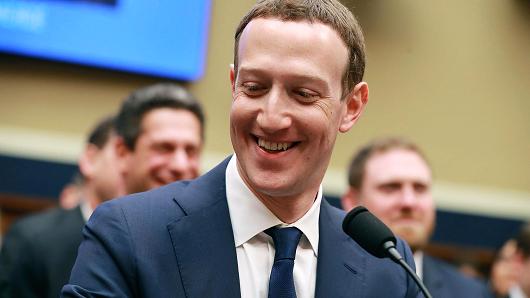 Facebook co-founder, Chairman and CEO Mark Zuckerberg smiles at the conclusion of his testimony before the House Energy and Commerce Committee in the Rayburn House Office Building on Capitol Hill April 11, 2018 in Washington, DC.
