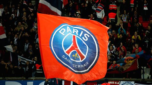 Paris Saint-Germain's supporters wave flags during the French Cup round of 16 football match between Paris Saint-Germain (PSG) and Guingamp (EAG) at the Parc des Princes stadium in Paris on January 24, 2018.