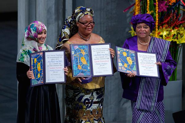 Joint winners Yemeni journalist Tawakul Karman, Liberian activist Leymah Gbowee and Liberian President Ellen Johnson Sirleaf hold up their prizes at the Nobel Peace Prize Award Ceremony at Oslo City Hall on December 10, 2011