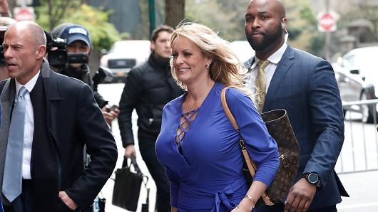 Adult-film actress Stephanie Clifford, also known as Stormy Daniels, arrives at ABC studios with her attorney Michael Avenatti (L) to appear on The View talk show in New York City, New York, U.S. April 17, 2018.