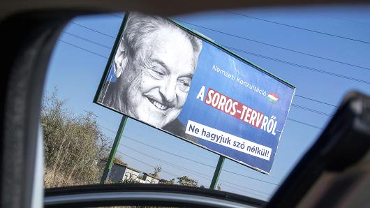 A billboard with a poster of Hungarian-American billionaire and philanthropist George Soros with the lettering 'National consultation about the Soros' plan - Don't let it pass without any words' is seen in the 22nd district of Budapest on October 16, 2017, as the conservative government prepares their new national consultation.