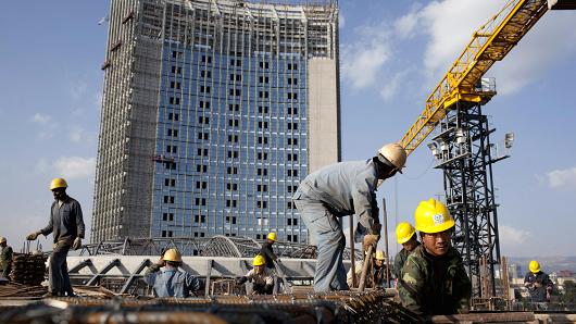 Chinese construction workers build the new African Union building on November 17, 2010, in Addis Ababa, Ethiopia.