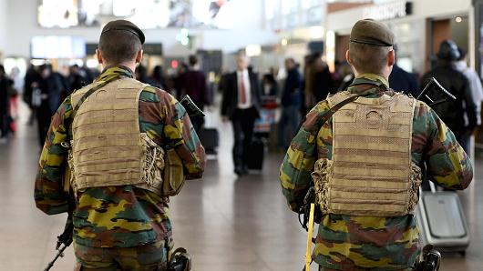 Military police soldiers patrol the Brussels Airport on November 18, 2015 in Zaventem, eastern Brussels.