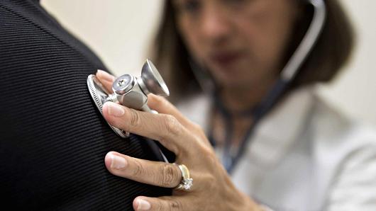 A medical doctor examines a patient with a stethoscope at a CCI Health and Wellness Services health center in Gaithersburg, Maryland.