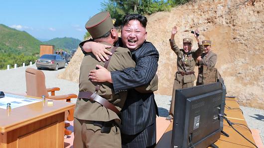 North Korean leader Kim Jong Un reacts with scientists and technicians of the DPRK Academy of Defence Science after the test-launch of the intercontinental ballistic missile Hwasong-14 in this undated photo released by North Korea's Korean Central News Agency (KCNA) in Pyongyang July, 5, 2017.