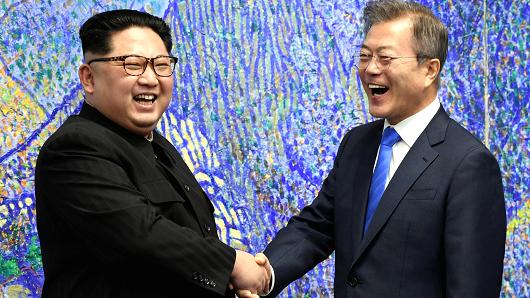South Korean President Moon Jae-in shakes hands with North Korean leader Kim Jong Un during their meeting at the Peace House at the truce village of Panmunjom inside the demilitarized zone separating the two Koreas, South Korea, April 27, 2018.