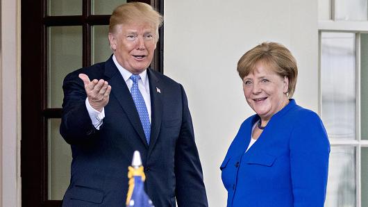 President Donald Trump and Angela Merkel, Germany's chancellor, right, stand for photographs at the West Wing of the White House in Washington, D.C., on Friday, April 27, 2018.