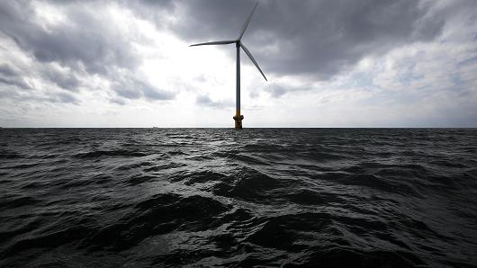 A wind turbine stands in the sea off the coast of Choshi City, Chiba Prefecture, Japan, on Monday, March 4, 2013.