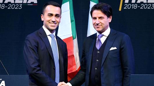Leader of the Italy's populist Five Star Movement, Luigi Di Maio (L), shakes hands with Giuseppe Conte, who could become Italy's next prime minister.