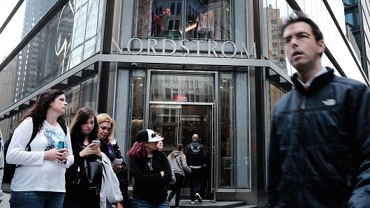 People walk by the newly opened Nordstrom menÕs store, the companyÕs first-ever Manhattan location in midtown at 57th and Broadway on April 12, 2018 in New York City.