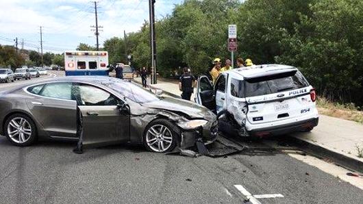 A Tesla sedan driving outbound on Laguna Canyon Road in “autopilot” collides with a parked Laguna Beach Police Department vehicle.