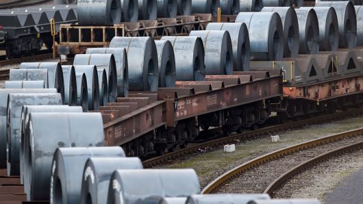 Coils of steel stand on trains in front of the ThyssenKrupp steel mill on March 5, 2018 in Duisburg, Germany.