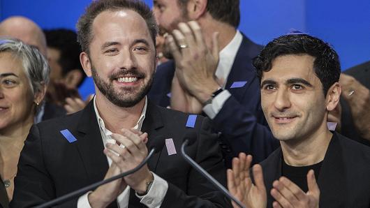 Drew Houston, chief executive officer and co-founder of Dropbox Inc., left, and Arash Ferdowsi, co-founder of Dropbox Inc., applaud during the company's initial public offering (IPO) at the Nasdaq MarketSite in New York, U.S., on Friday, March 23, 2018.