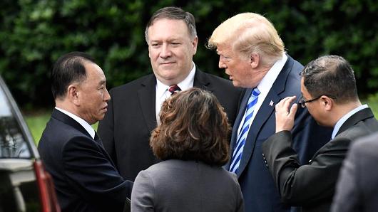 US President Donald Trump speaks with Kim Yong Chol, outside the Oval Office of the White House on June 1, 2018.