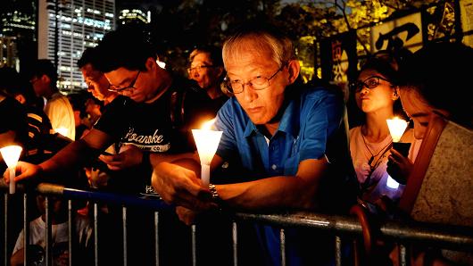 People take part in a candlelight vigil to mark the 29th anniversary of the crackdown of pro-democracy movement at Beijing's Tiananmen Square in 1989, at Victoria Park in Hong Kong, China June 4, 2018.