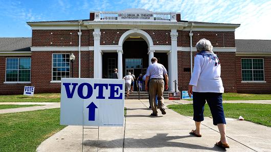 Voters arrive to cast their ballots during the Alabama Primary election at Huntingdon College, Tuesday, June 5, 2018, in Montgomery, Ala.