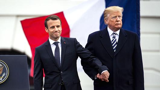 Emmanuel Macron, France's president, left, shakes hands with U.S. President Donald Trump at an arrival ceremony during a state visit in Washington, D.C., on Tuesday, April 24, 2018.