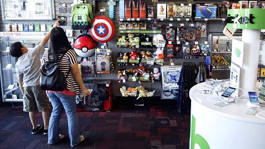 Customers browse collectible video game merchandise for sale at a GameStop Corp. store in West Hollywood, California.
