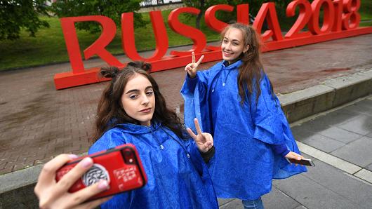 Girls take a selfie by the Russia 2018 sign of the 2018 FIFA World Cup in Yekaterinburg, Russia.