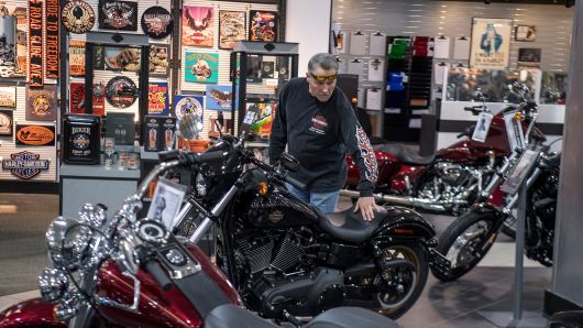A customer looks at a motorcycle on display at the Oakland Harley-Davidson dealership in Oakland, California, U.S., on Friday, April 14, 2017. 