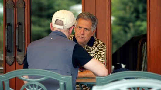 Leslie 'Les' Moonves, president and chief executive officer of CBS Corp., right, speaks with Jeff Bezos, chairman, president and chief executive officer of Amazon.com Inc., at the Allen & Co. Media and Technology Conference in Sun Valley, Idaho, U.S., on Thursday, July 7, 2011. 