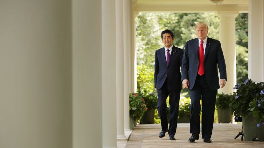 Japanese Prime Minister Shinzo Abe and U.S. President Donald Trump arrive for a joint news conference at the White House June 7, 2018.