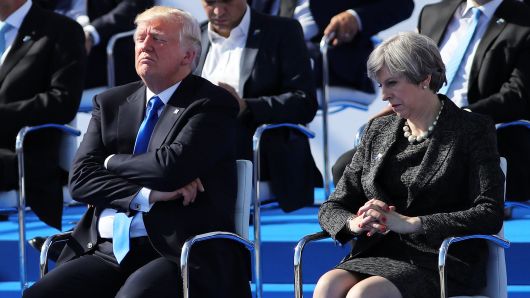 President, Donald Trump and British Prime Minister, Theresa May are pictured ahead of a photo opportunity of leaders as they arrive for a NATO summit meeting on May 25, 2017 in Brussels, Belgium.