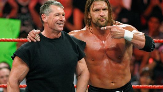 World Wrestling Entertainment Inc. Chairman Vince McMahon (L) and wrestler Triple H appear in the ring during the WWE Monday Night Raw show at the Thomas & Mack Center August 24, 2009