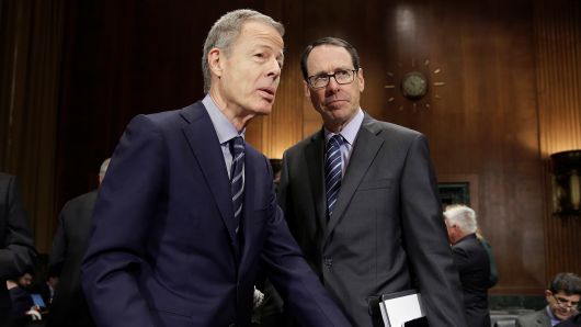 Chairman and Chief Executive Officer of Time Warner Jeffrey Bewkes (L) speaks with Chairman and Chief Executive Officer of AT&T Randall Stephenson before a Senate Judiciary Committee Antitrust Subcommittee hearing on the proposed deal between AT&T and Time Warner in Washington, U.S., December 7, 2016.