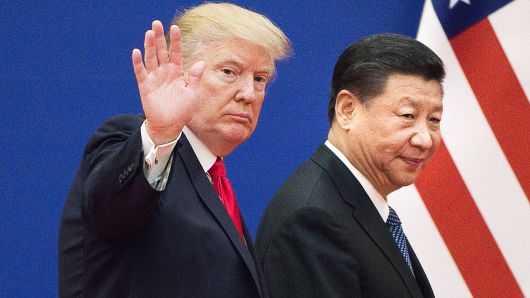 U.S. President Donald Trump and China's President Xi Jinping leave a business leaders event at the Great Hall of the People in Beijing on November 9, 2017.
