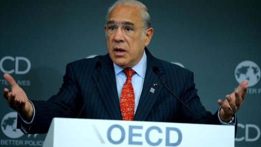 Organisation for Economic Co-operation and Development (OECD) General Secretary Angel Gurria gestures as he addresses a meeting at OECD headquarters in Paris on June 7, 2017.