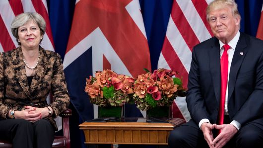 British Prime Minister Theresa May and US President Donald Trump wait for a meeting at the Palace Hotel in New York.