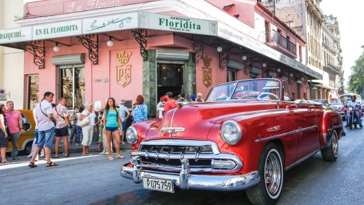 A crowd of tourists seen outside of Floridita, a historic fish restaurant and cocktail bar, famous for having been one of the favorite hangouts of Ernest Hemingway in Havana. 