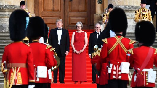 Britain's Prime Minister Theresa May and her husband Philip May greet U.S. President Donald Trump, First Lady Melania Trump at Blenheim Palace on July 12, 2018 in Woodstock, England. 