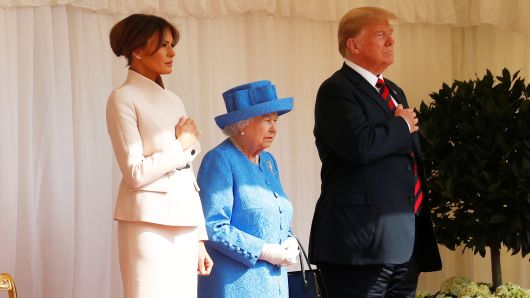 President Donald Trump and the First Lady Melania Trump are met by Britain's Queen Elizabeth as they arrive for tea at Windsor Castle in Windsor, Britain, July 13, 2018. 