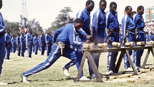 The Fifth Brigade of the Zimbabwean army, trained by North Korea, practice karate at Rufaro Stadium in Harare, Zimbabwe, in May 1984.